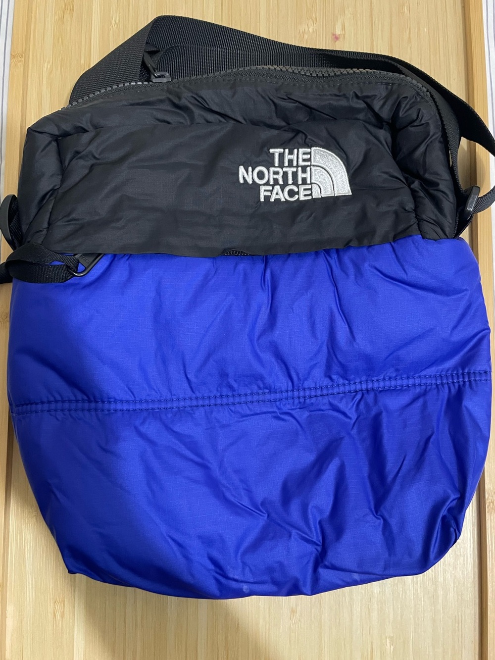 The Notth Face Nuptse Crossbody Bag ~ Good Used Condition ~ Black and Royal Blue